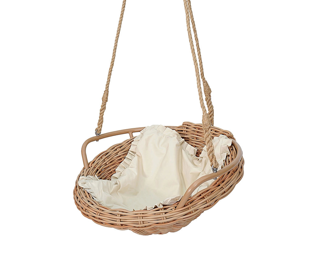 A natural wicker hanging摇篮 with rope suspension straps and a cream fabric liner, shown against a plain white background.